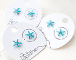 Load image into Gallery viewer, three pairs of blue starfish earrings on a white background
