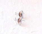 Load image into Gallery viewer, A pair of silver earrings with a cocktail glass design, placed on a white surface.
