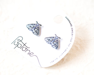 a pair of earrings with a butterfly design, placed on a white background.