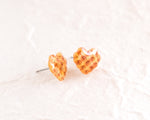 Load image into Gallery viewer, a pair of yellow heart shaped earrings on a white surface
