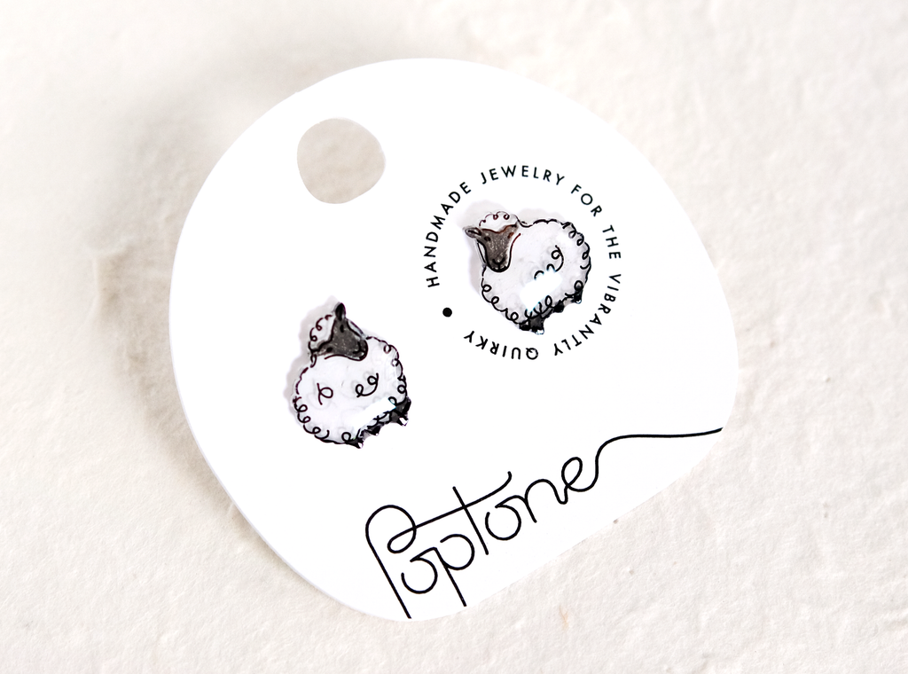 a picture of a pair of earrings on a white background