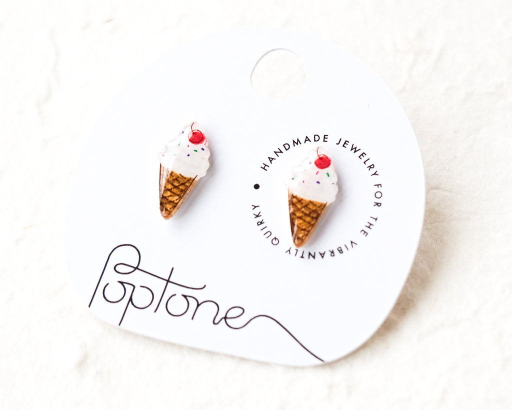 a pair of ice cream cone earrings on a card