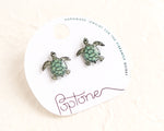 Load image into Gallery viewer, a pair of sea turtle earrings on a white background
