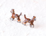 Load image into Gallery viewer, Two small, colorful animal figurines are sitting on a white surface.
