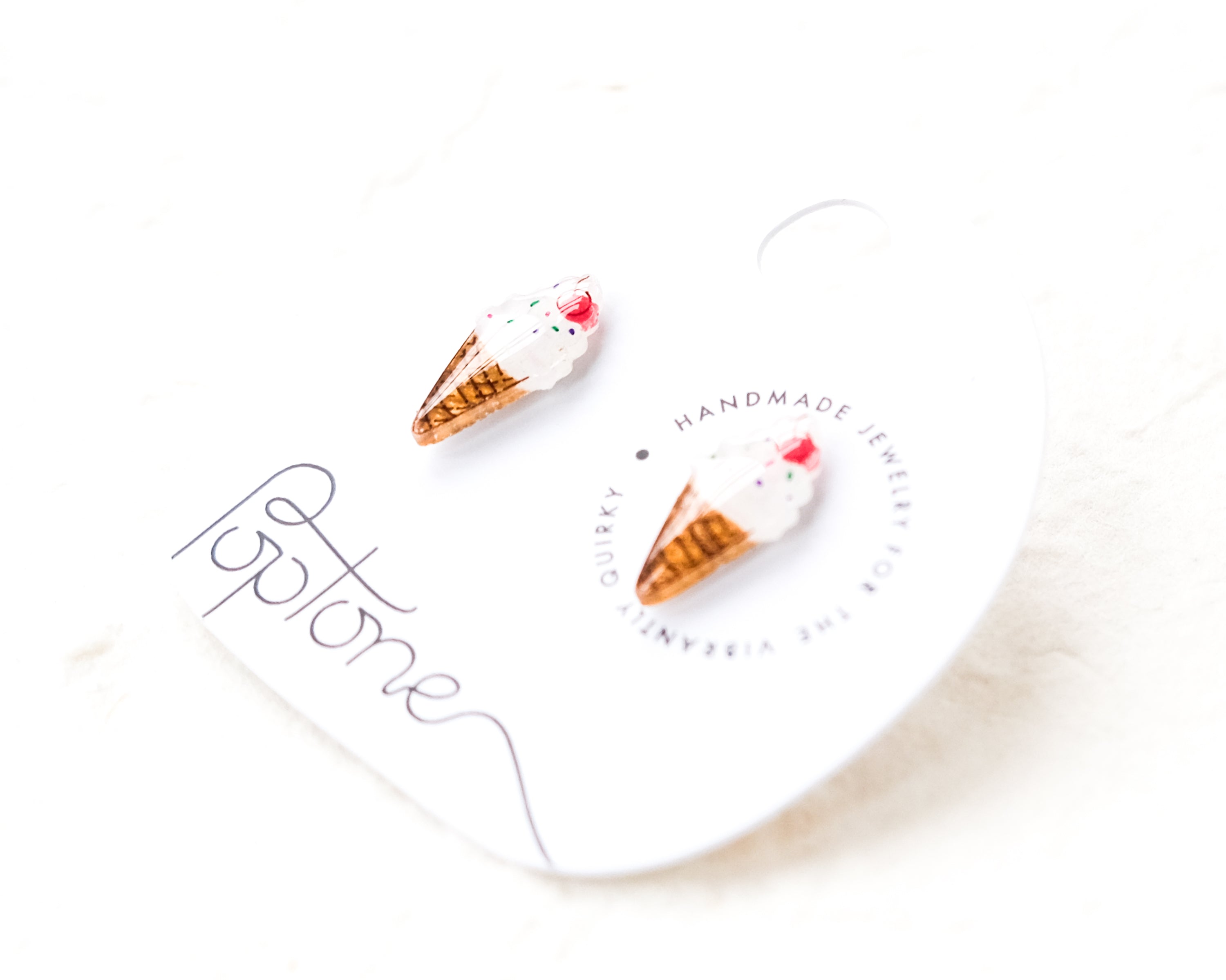 a couple of ice cream cones sitting on top of a white plate