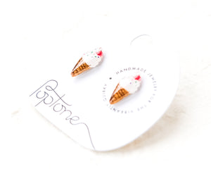 a couple of ice cream cones sitting on top of a white plate