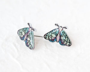 A pair of earrings in the shape of colorful butterflies, with intricate designs and patterns.