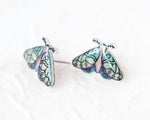 Load image into Gallery viewer, two colorful butterfly-shaped earrings with intricate designs on their wings.
