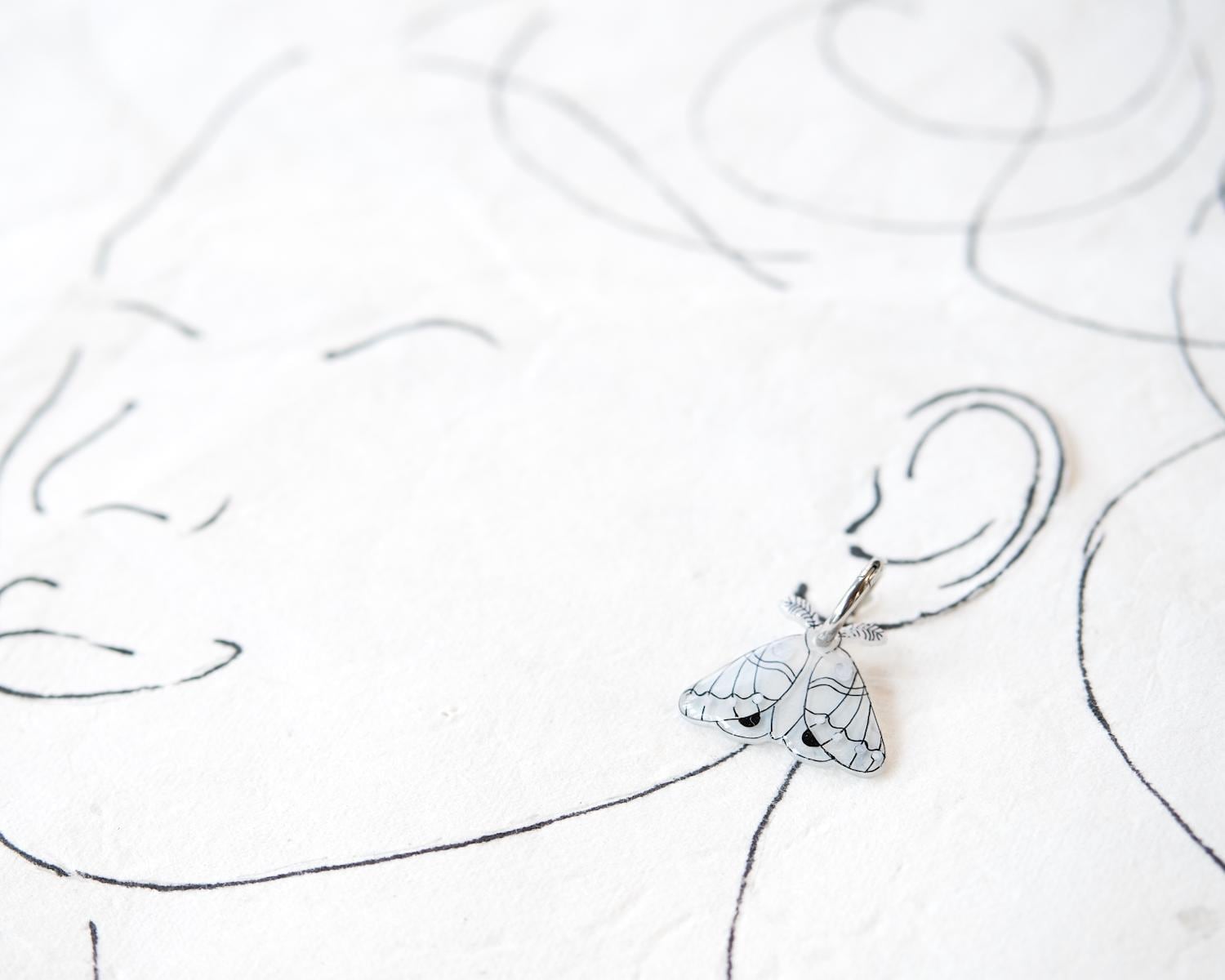 White and Silver Elegant Moth Earrings on Silver Hinged 12 mm Huggie Hoops