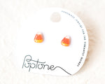 Load image into Gallery viewer, a pair of earrings made of candy corn, displayed on a white background.
