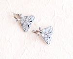 Load image into Gallery viewer, two silver butterfly charms with intricate designs, placed on a white background.
