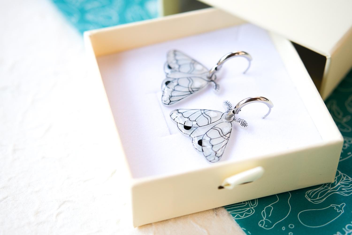 White and Silver Elegant Moth Earrings on Silver Hinged 12 mm Huggie Hoops