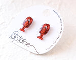 Load image into Gallery viewer, a pair of red lobster earrings displayed on a white circular card with text.

